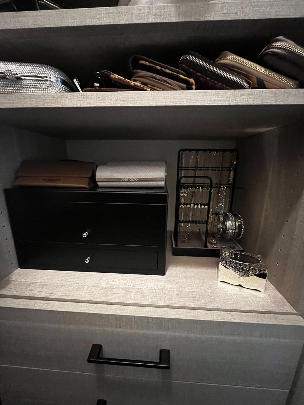 Reorganized closet spotlighting accessories for ea