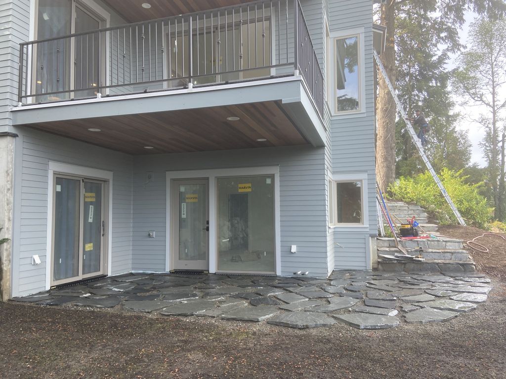 Wrap-around flagstone patio on new construction