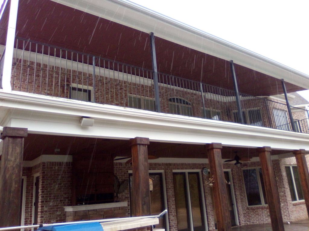 2 story covered patio with stained cedar post and 