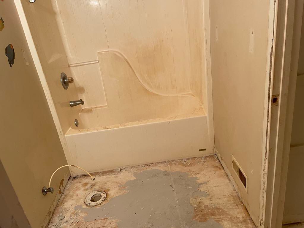 Before picture before demo of old tub and new tub 