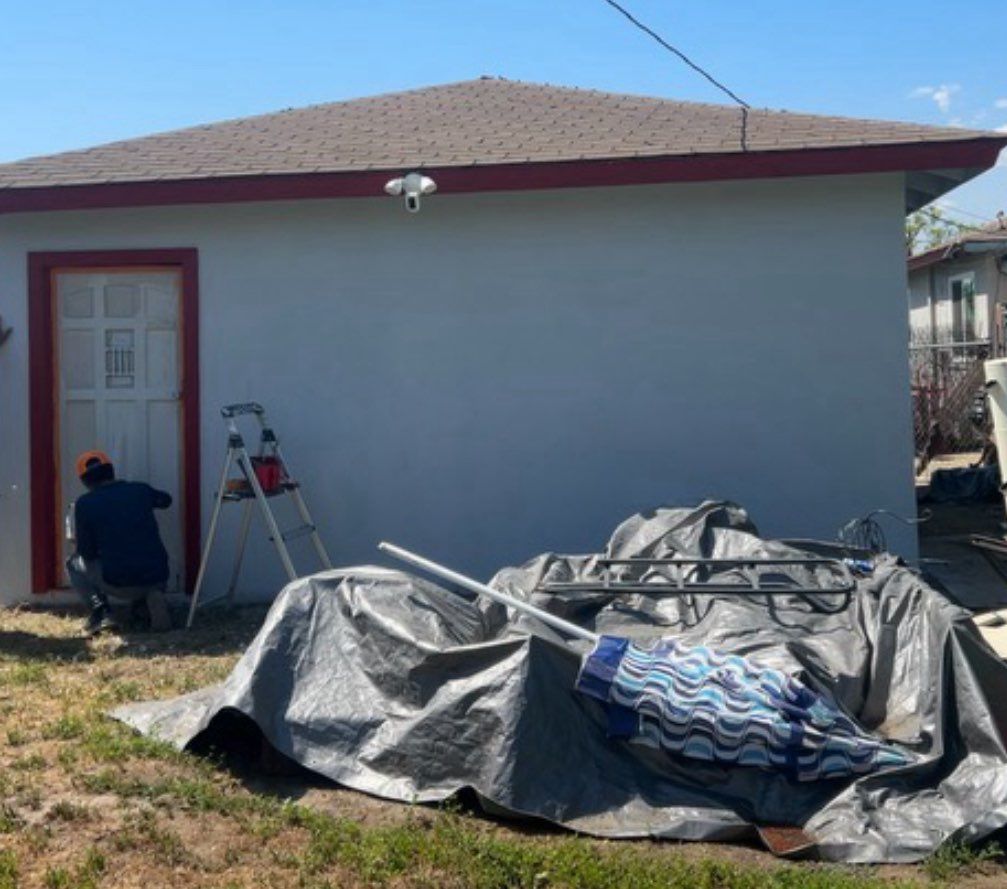 Patched holes and repainted garage 