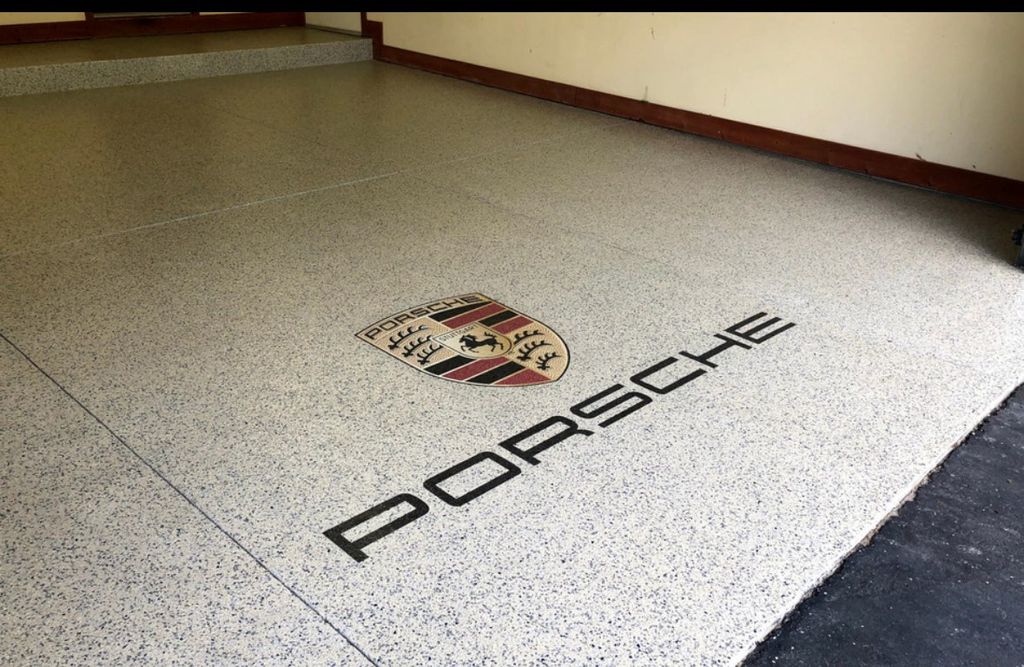 Epoxy garage floor with custom logo. We  can place