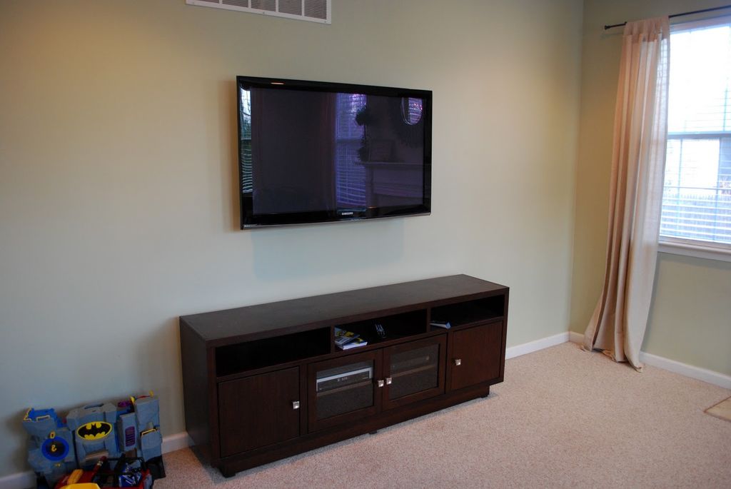 TV installation with in-wall wire concealment