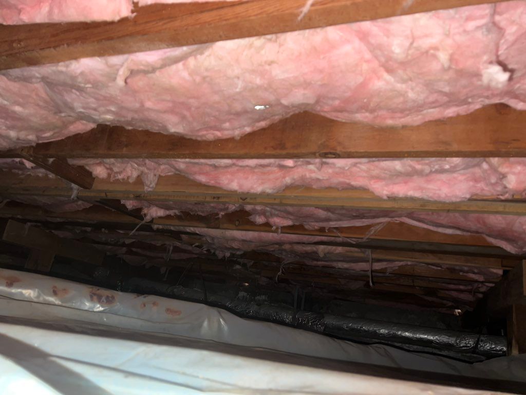 Crawl space insulation installing