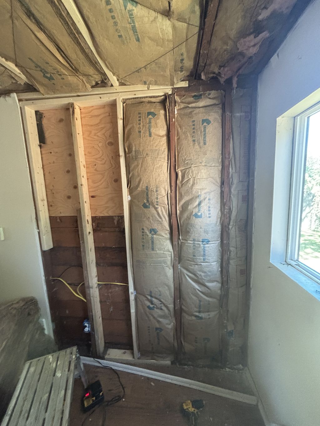 installation of insulation in walls and ceiling