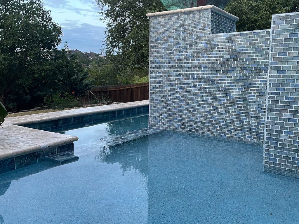 Glass and porcelain tile coupled with aqua blue pe