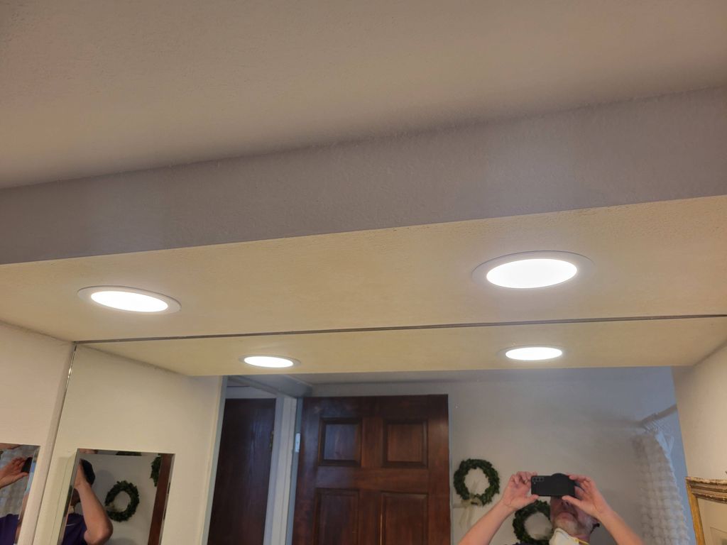 lighting installation above bathroom vanity. 