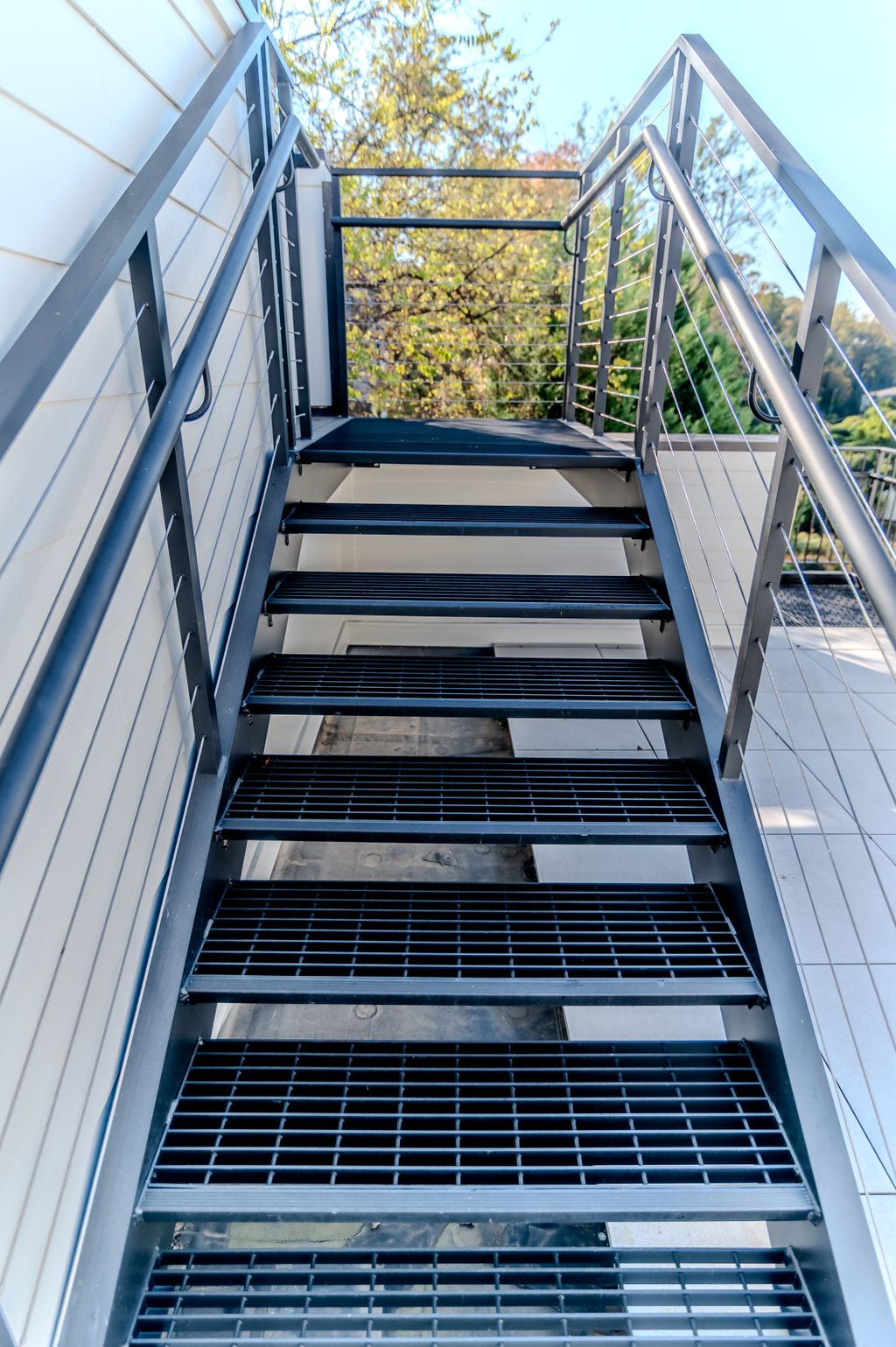 Full metal exterior stair with cable railing syste