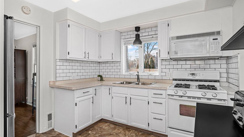 kitchen - cabinet repainting and new hardware, til