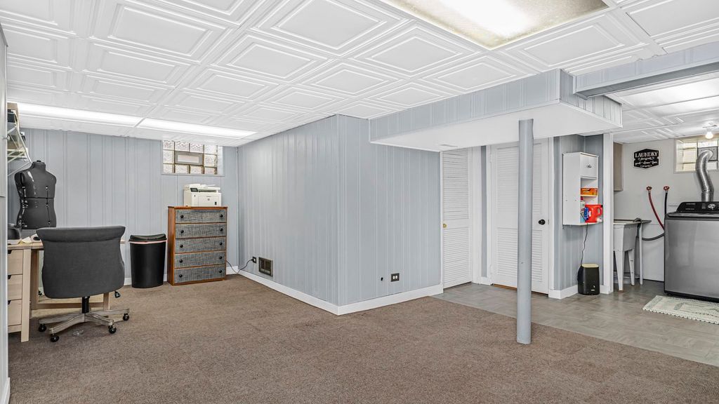 basement - new flooring, painted walls, and staged