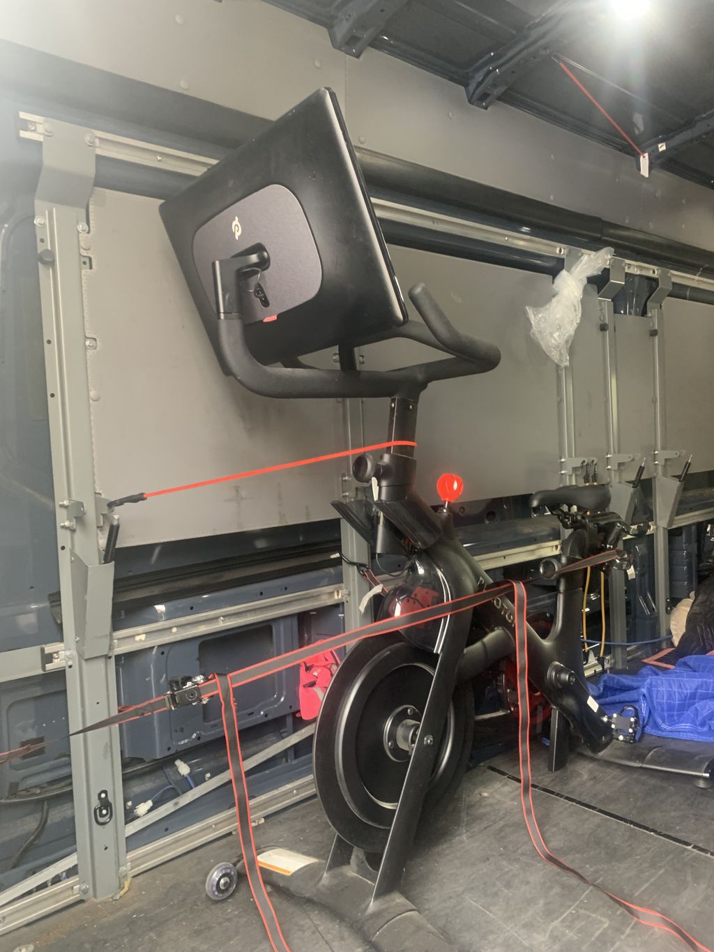 Moving and securing peloton bicycle
