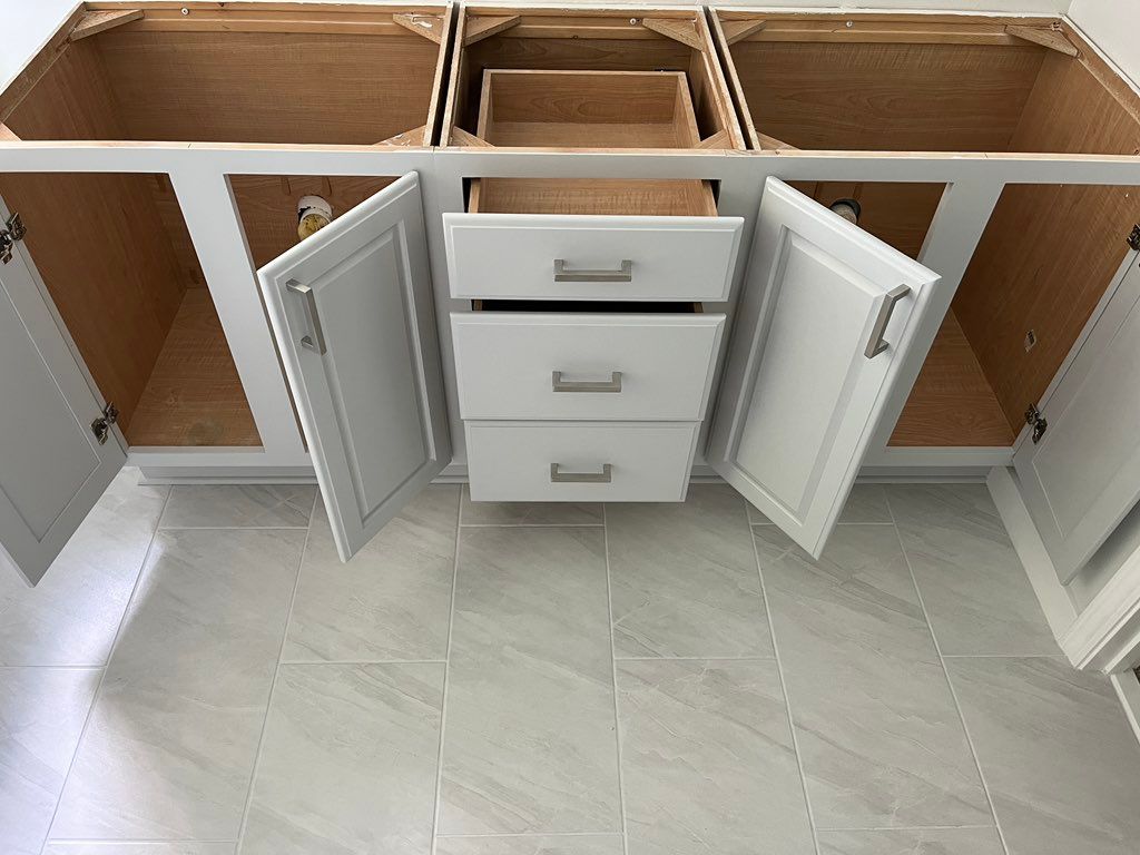 Sanding,priming and painting cabinets of bathroom 