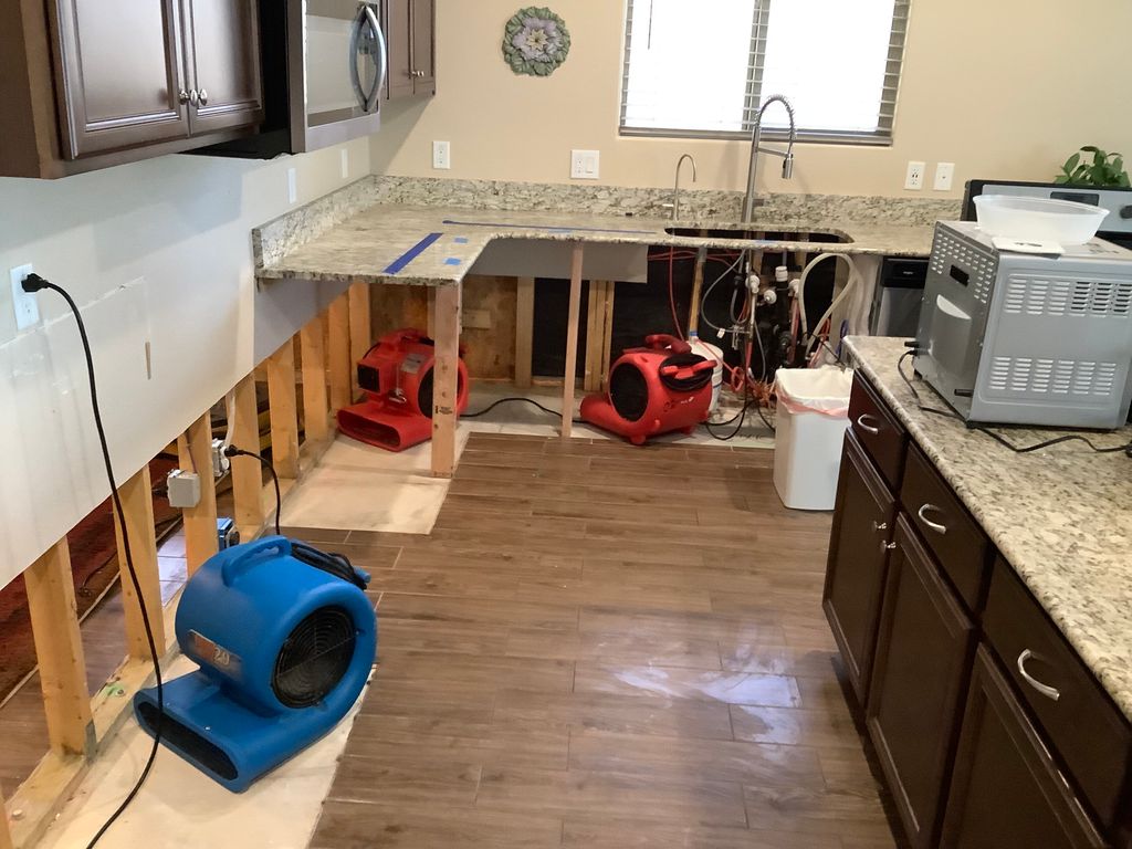 leak beneath kitchen cabinets
