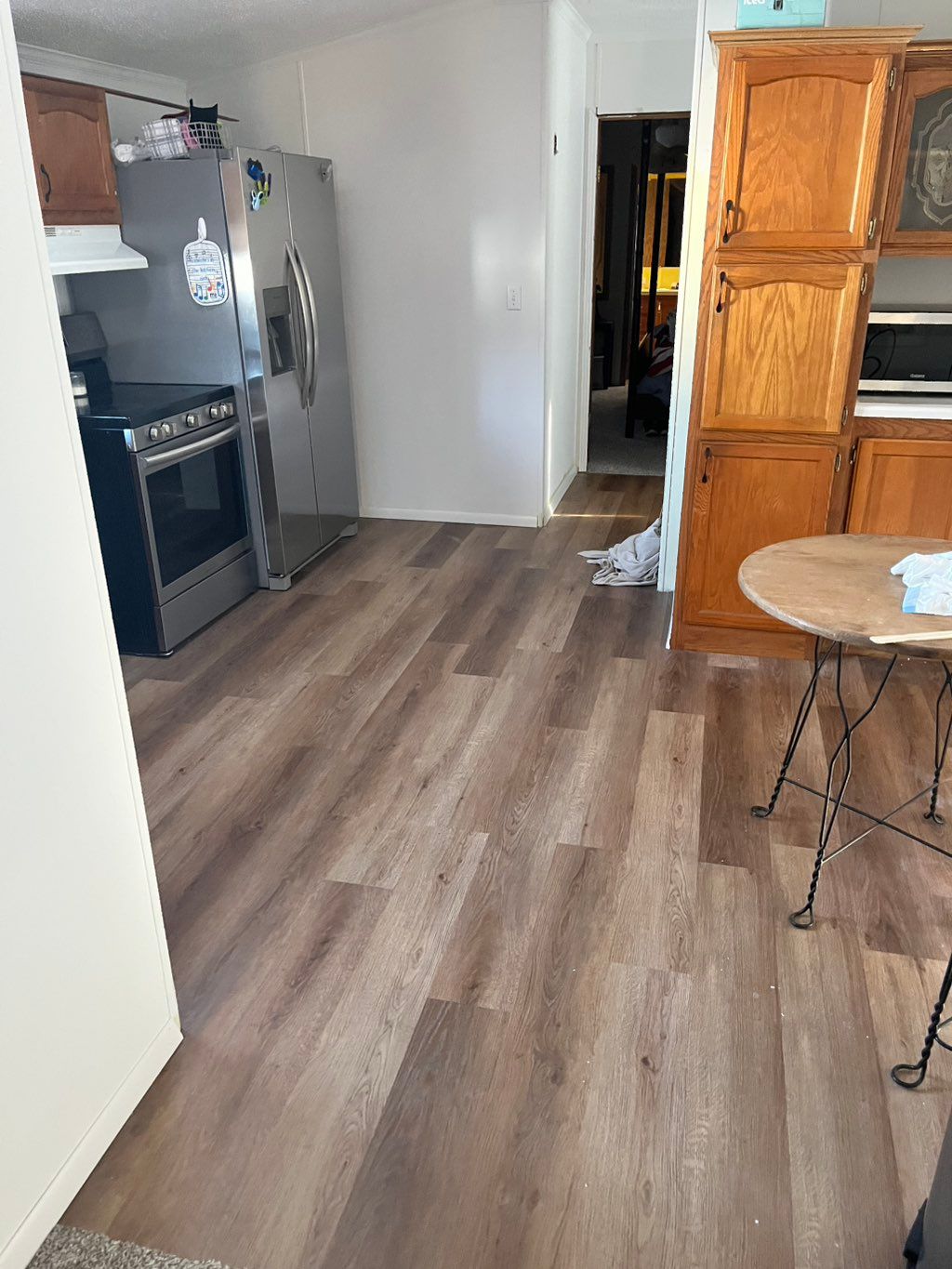 Vinyl plank flooring, install with new refrigerato