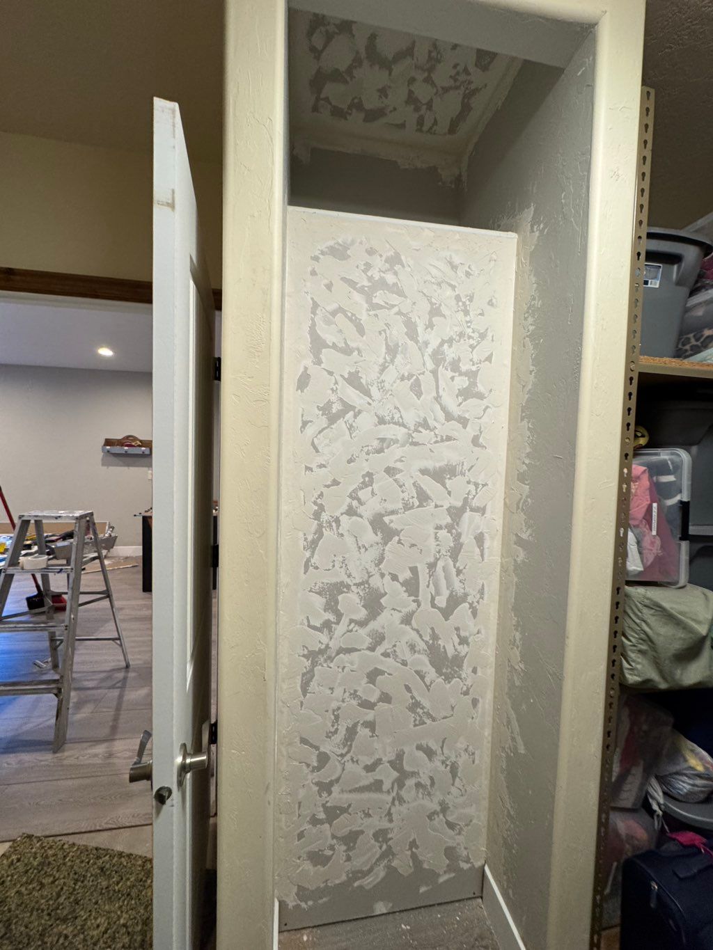 New wall and shelving installed and painted