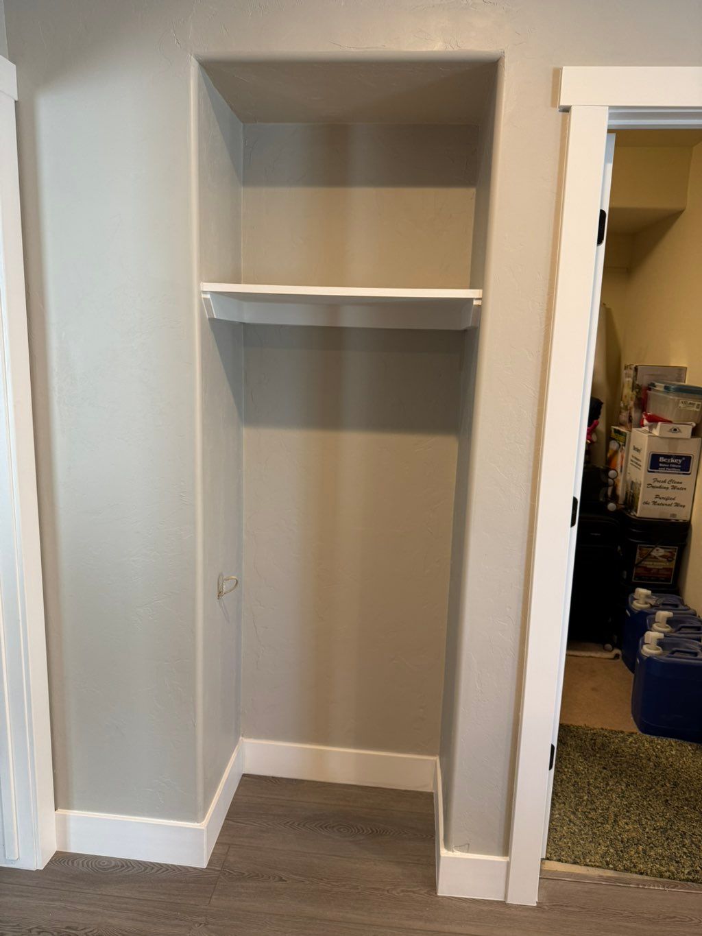 New wall and shelving installed and painted