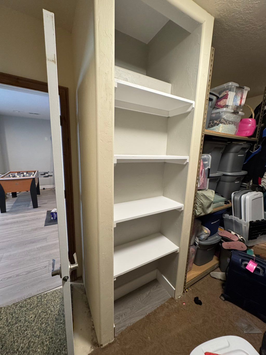 New wall and shelving installed and painted