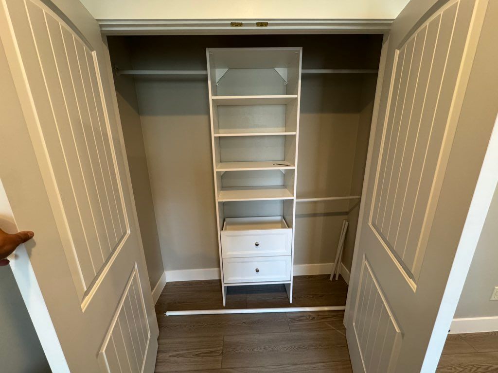 Freshly trimmed and painted closet with new shelve