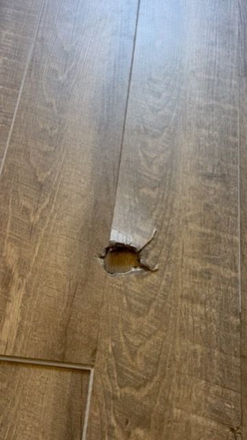 Flooring Repair; Huge hole in floor from a burn. 