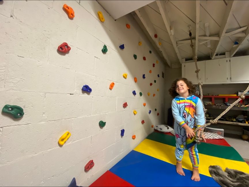 Basement paint job and a custom rock wall for chil