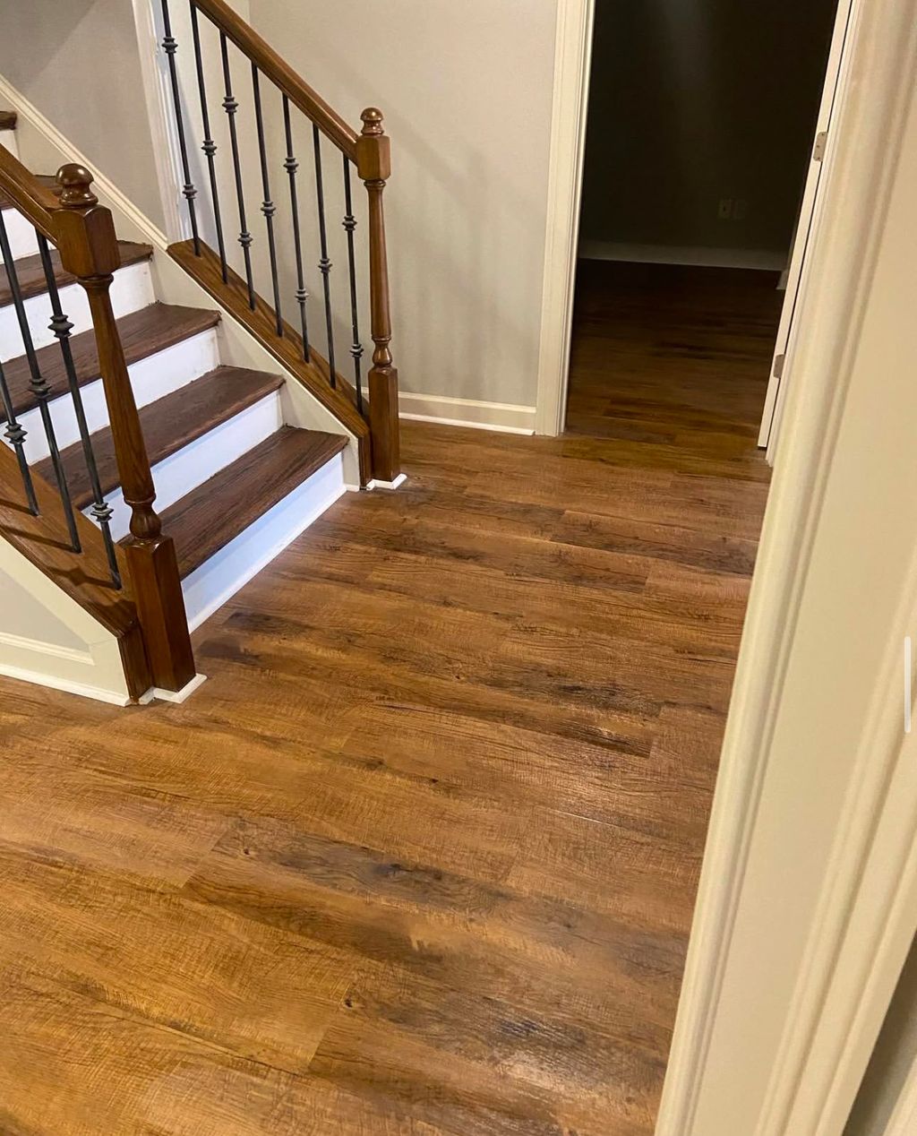 Elegant staircase upgrade with rich-toned hardwood
