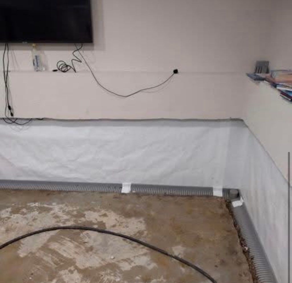 Basement waterproofing job in progress