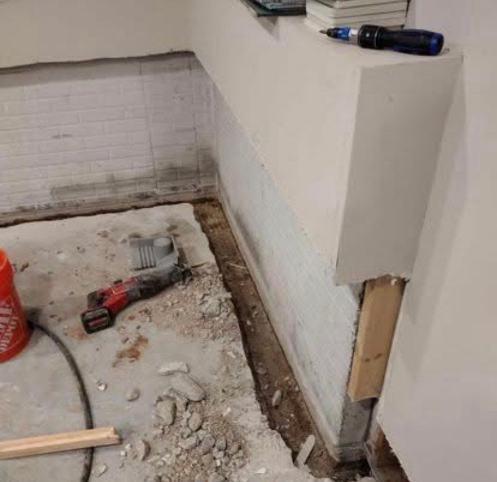 Basement waterproofing job in progress