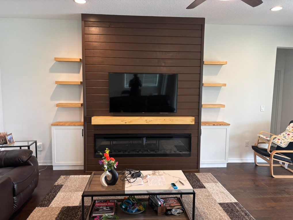 Custom built wall and cabinets with floating shelv