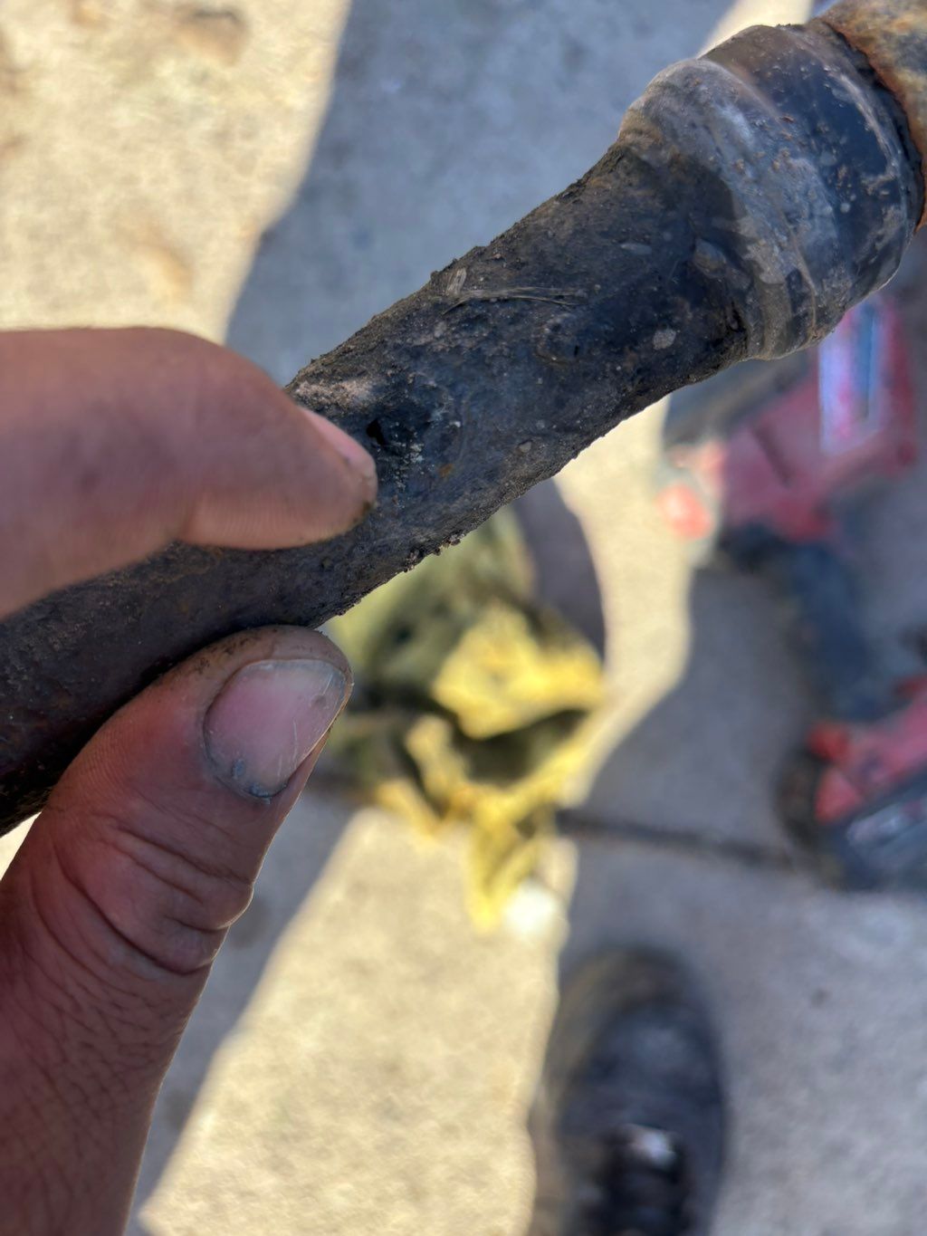 Galvanized pipe hole in water main.