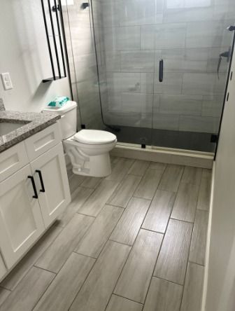Tiles scrubbed, toilet sanitized, sink polished, a