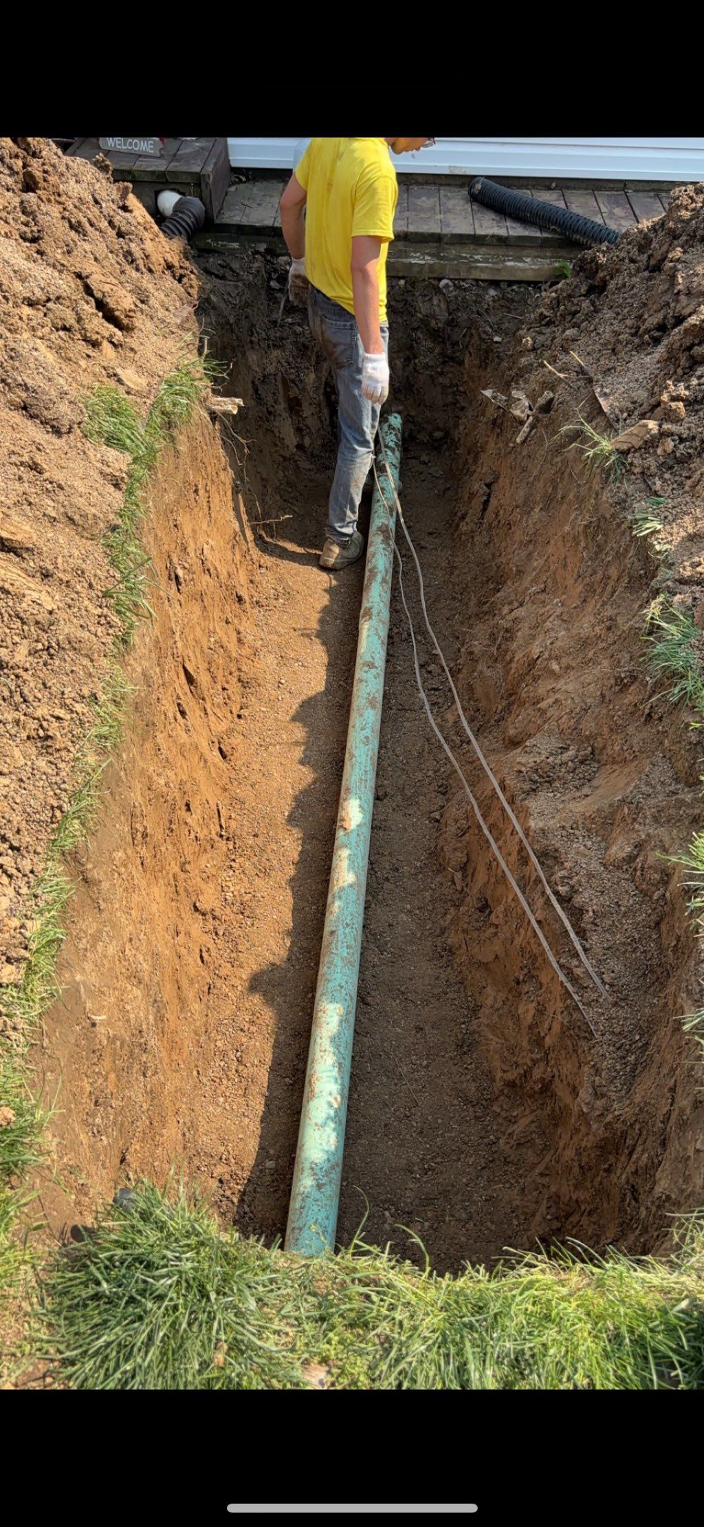 Before ( 10ft of broken sewer line replaced) 