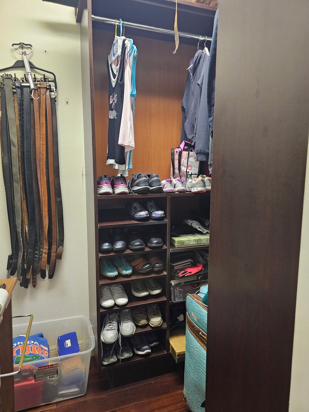 Husband's closet after; uncluttered with room to s