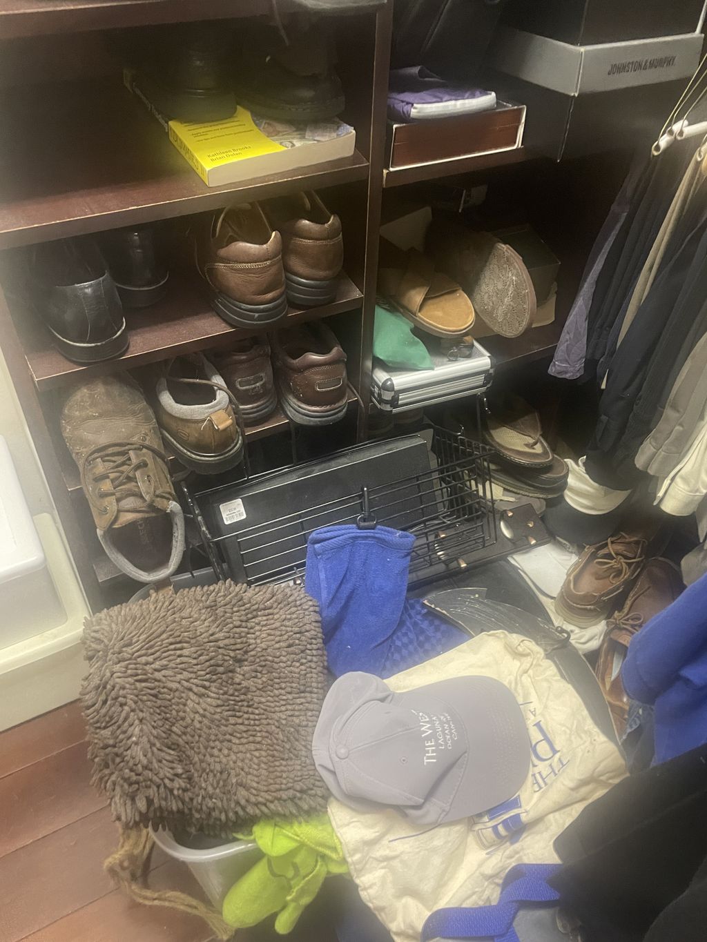 Husband's closet before; with a multitude of unkno