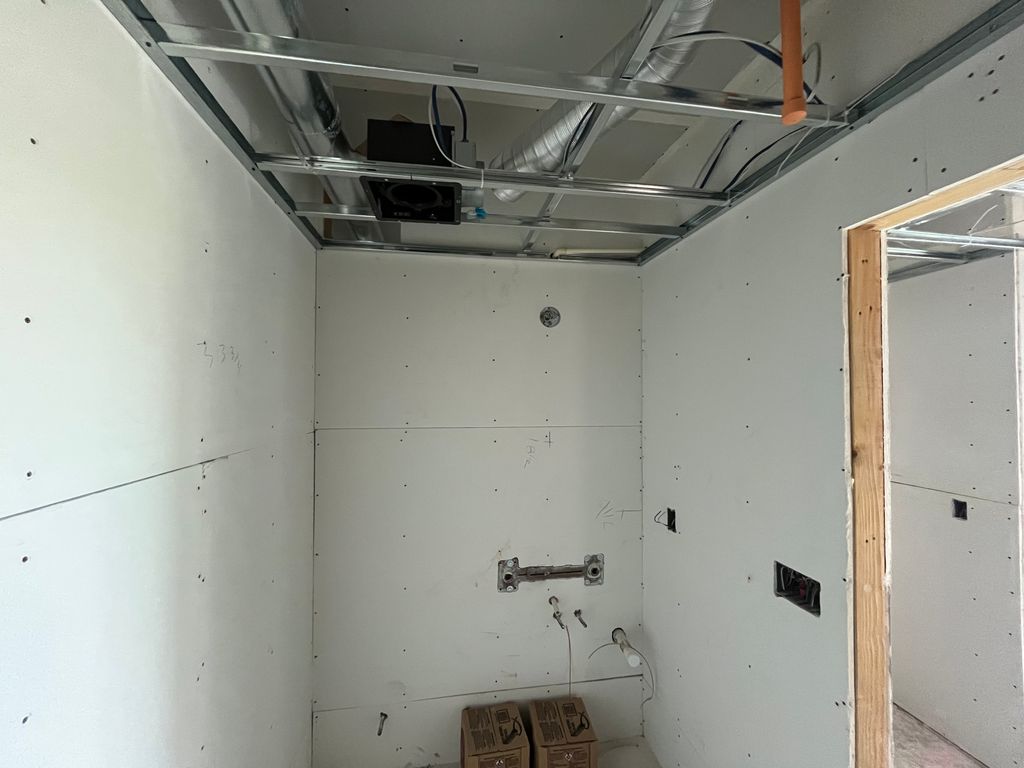 Installing a fan for the bathroom.