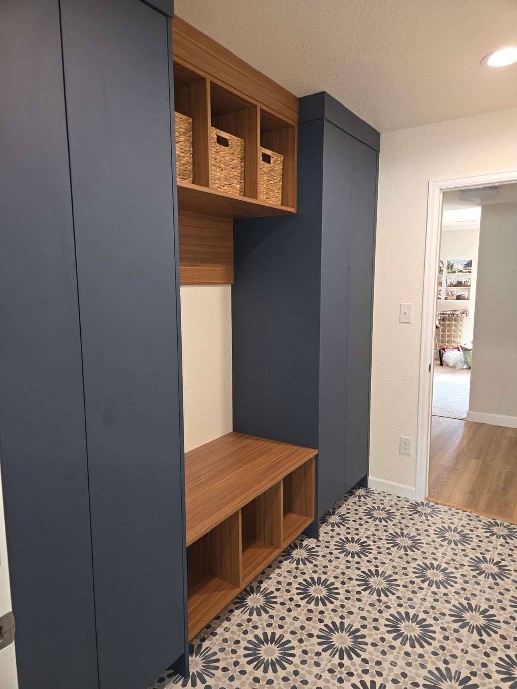 build a mudroom with new tile, cabinets, door, tex