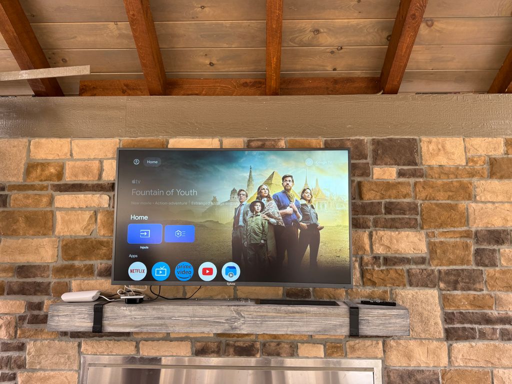 TV mounted, Apple TV plugged in, and Wi-Fi network