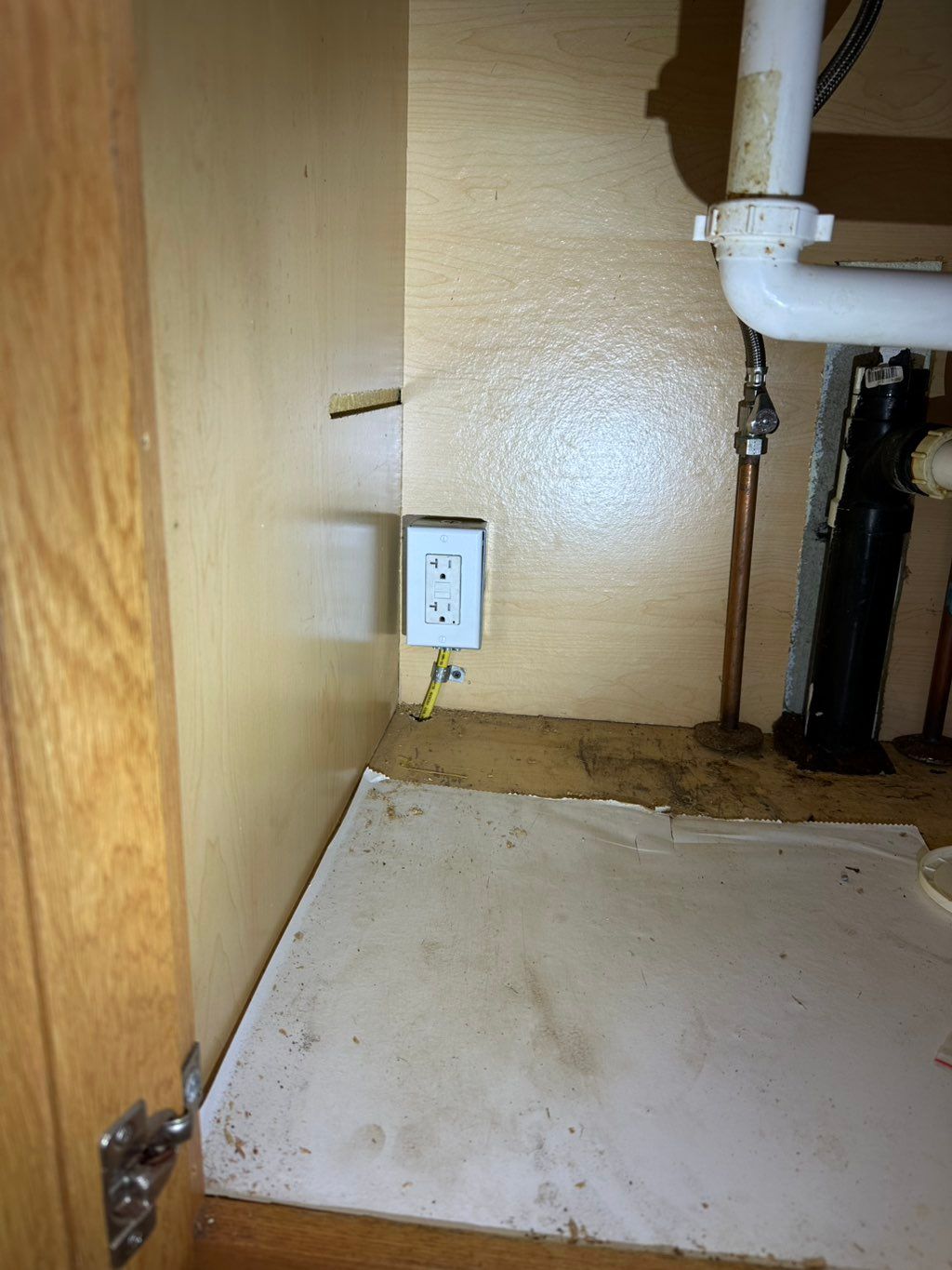 Garbage disposal outlet from panel 