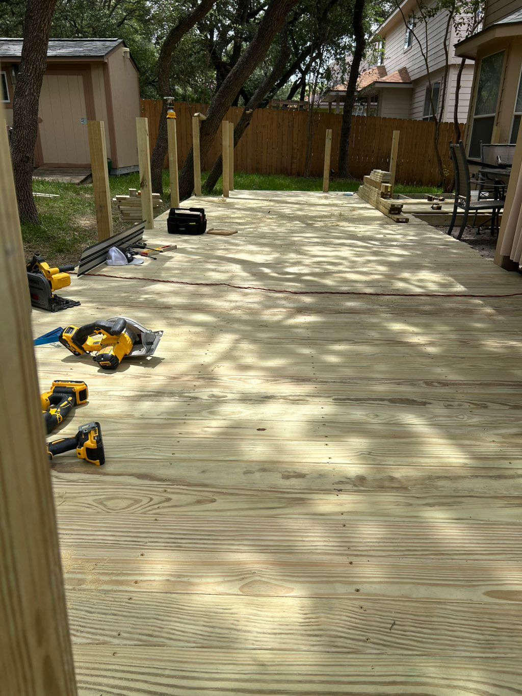 Building a wooden deck with the railings.