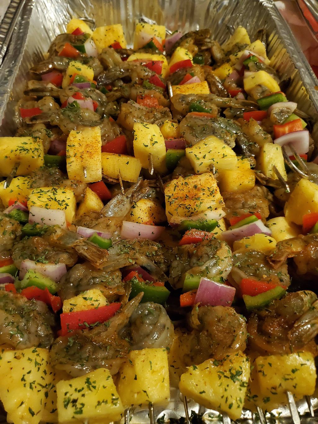 Prepping shrimp skewers
