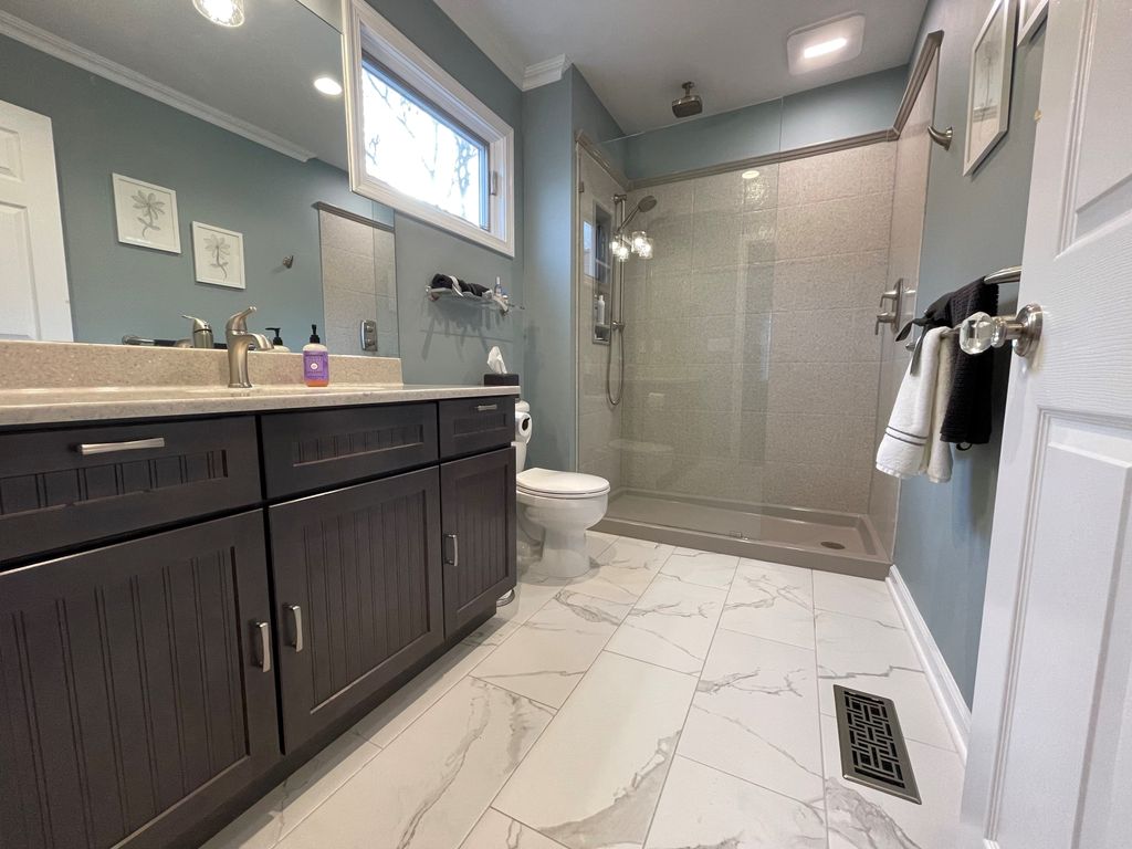 Bathroom remodel featuring custom Shaker vanity, O