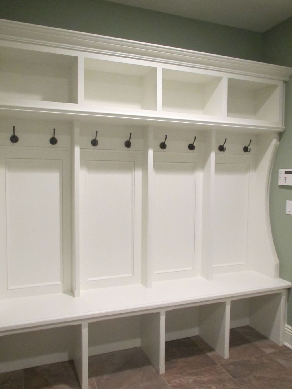 Mudroom built-in with recessed panel wainscot, int