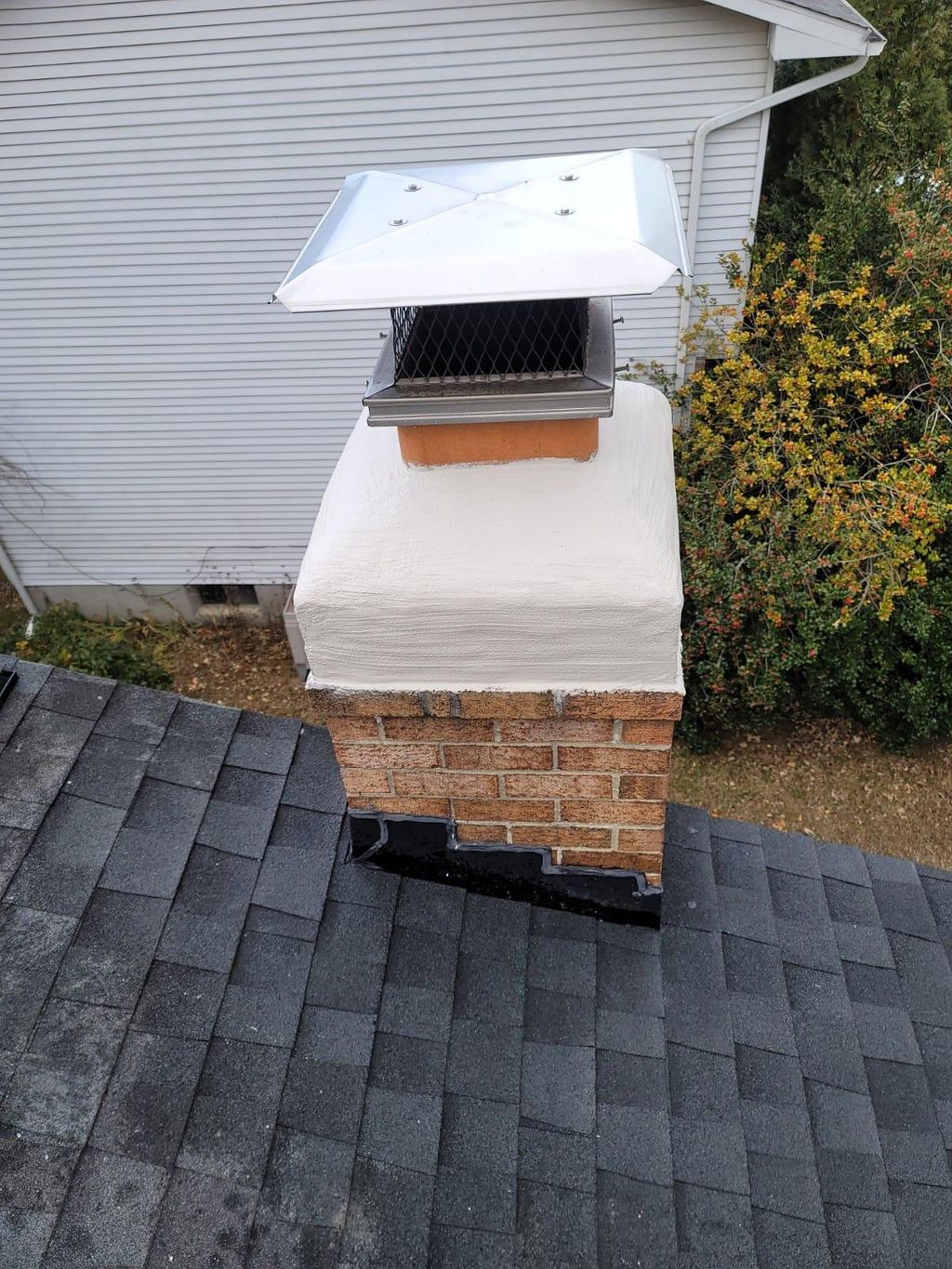 Chimney cap repair by Smoky Sweeper. 