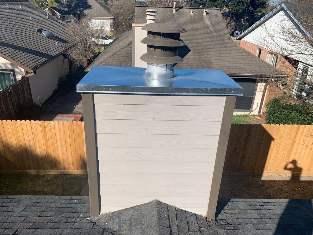Chimney cap installation and wood siding repair by