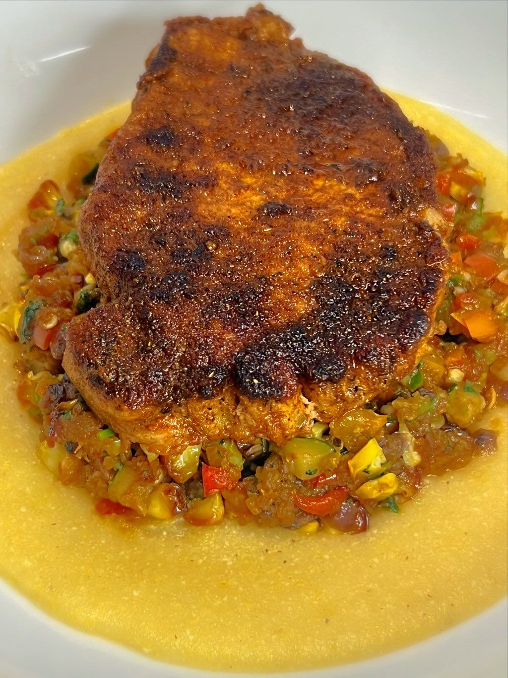 Spiced pork chops with polenta and succotash