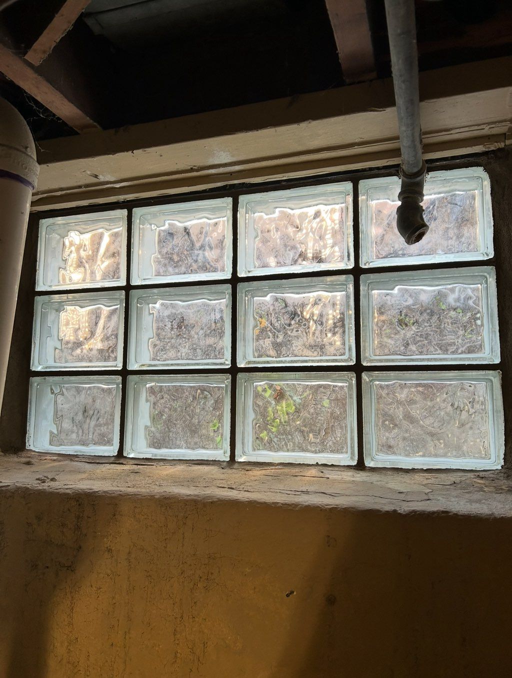 Tuckpointed entire glass block inside and out.