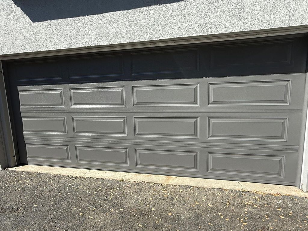Fresh modern gray garage door installation — sleek