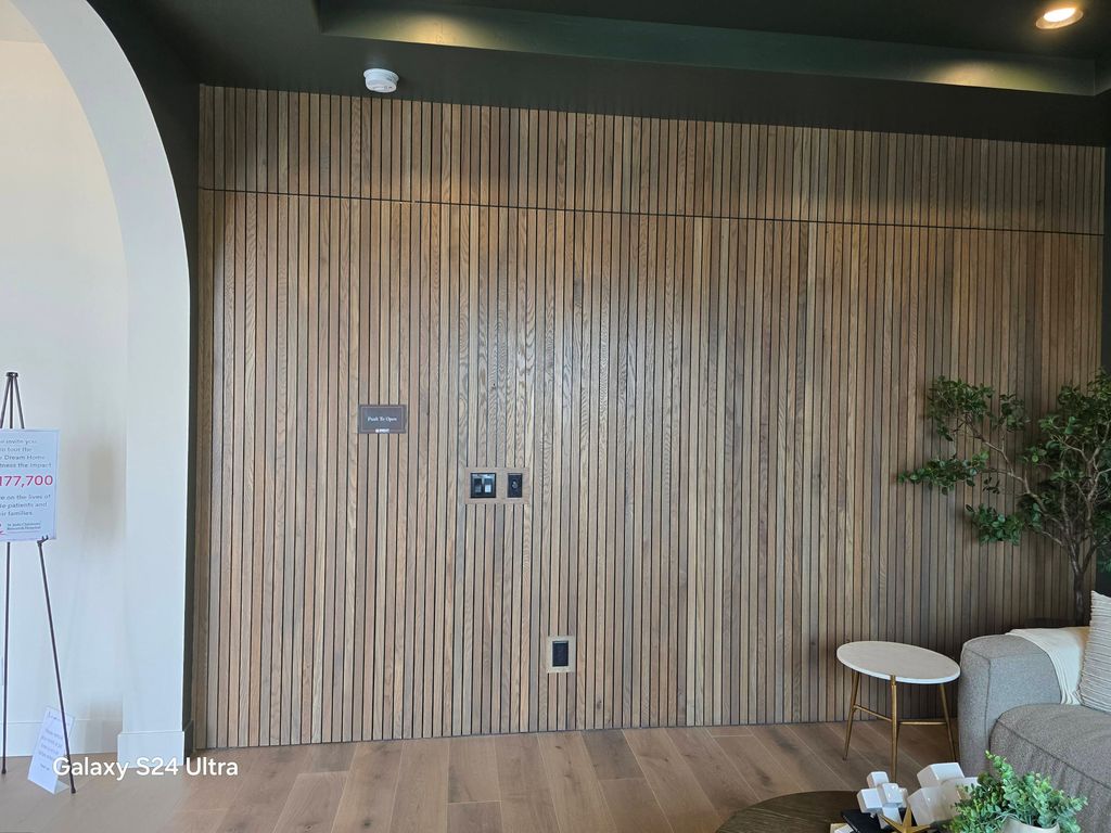 Hidden door in this wall with a bar on the inside.