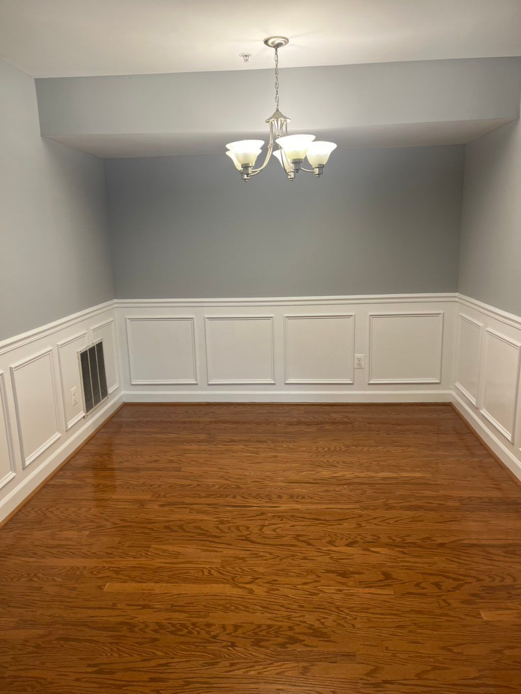 Wiping and dusting baseboards and wainscoting is i