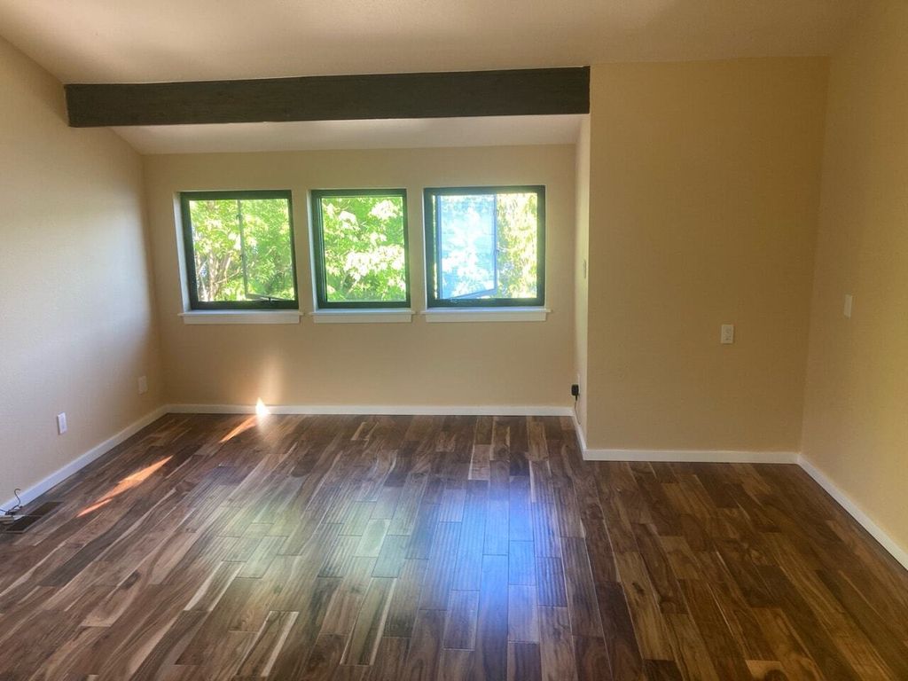 Flooring (engineered hardwood) and trim installed