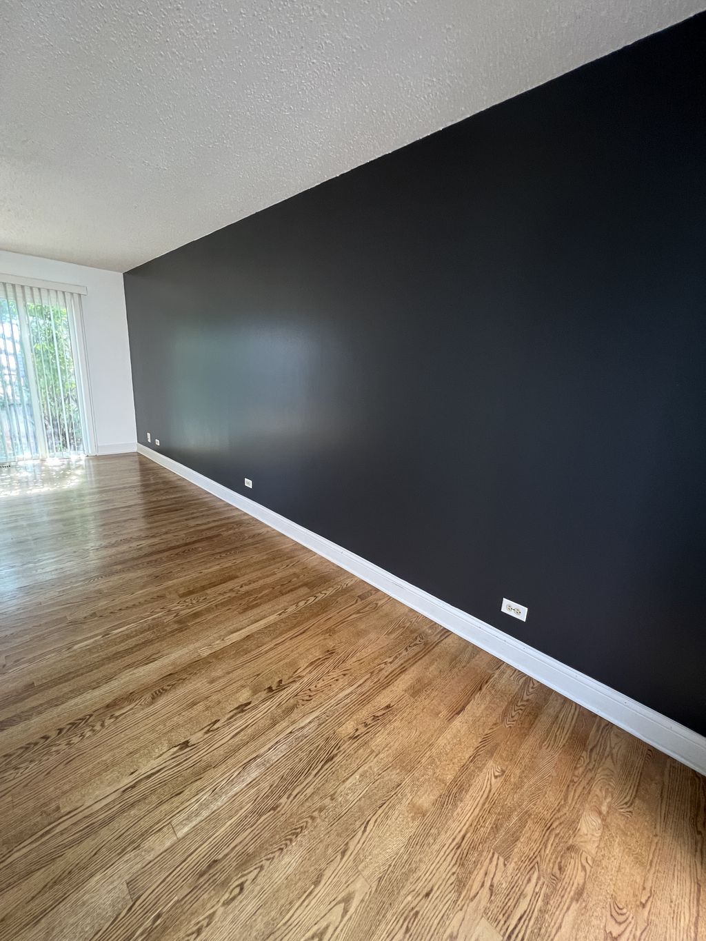 Master bedroom charcoal accent wall